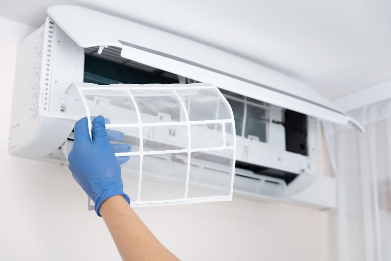Replacing an air conditioning filter during a maintenance visit